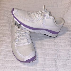 Nike Free Tennis Shoes size 8. White and purple